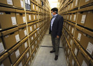 Steve Murray, director of the Alabama Department of Archives and History, looks through boxes containing archival materials in Montgomery, Ala., on Thursday, Aug. 13, 2020. Murray and other current leaders of the agency are confronting the early legacy of the department, which once embraced the "lost cause" version of Civil War history that diminished the role of slavery and portrayed the Southern cause as noble. (AP Photo/Jay Reeves)