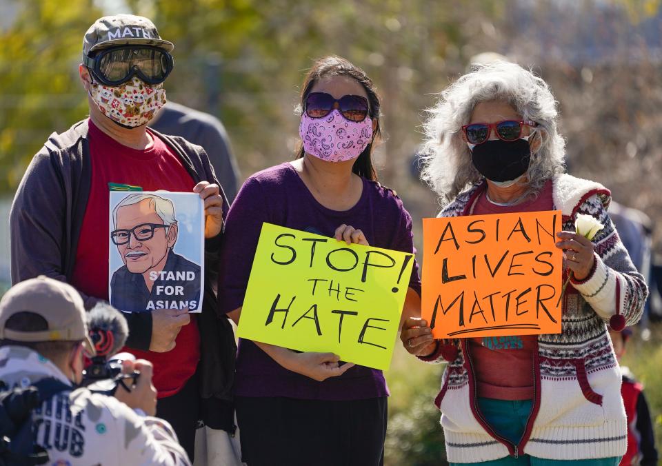 A man holds a portrait of Vichar Ratanapakdee, an 84-year-old immigrant from Thailand who was violently shoved to the ground in a deadly attack in San Francisco, during a rally to raise awareness of anti-Asian violence and racist attitudes, in Los Angeles on Feb. 20. The rally was in response to the string of violent racist attacks against Asians during the pandemic.