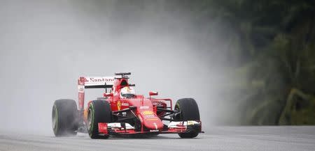 Formula One - F1 - Malaysian Grand Prix 2015 - Sepang International Circuit, Kuala Lumpur, Malaysia - 28/3/15 Ferrari's Sebastian Vettel in action during qualifying Reuters / Olivia Harris