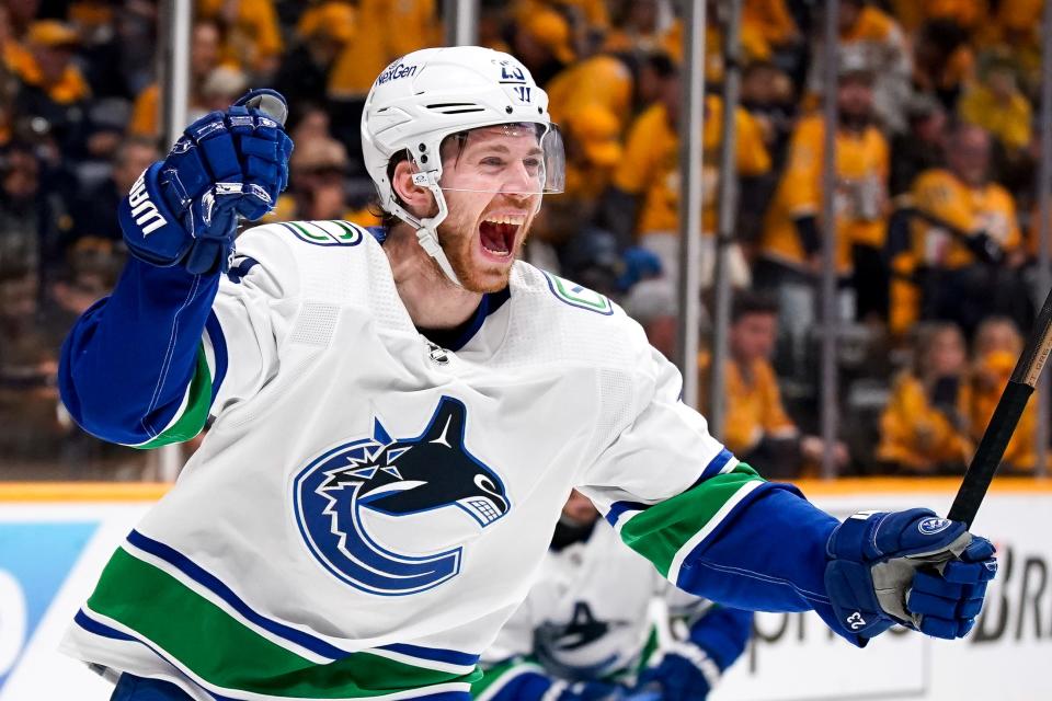 Vancouver Canucks center Elias Lindholm (23) celebrates making the game-winning goal against the Nashville Predators during overtime in Game 4 of an NHL hockey Stanley Cup first-round playoff series at Bridgestone Arena in Nashville, Tenn., Sunday, April 28, 2024.