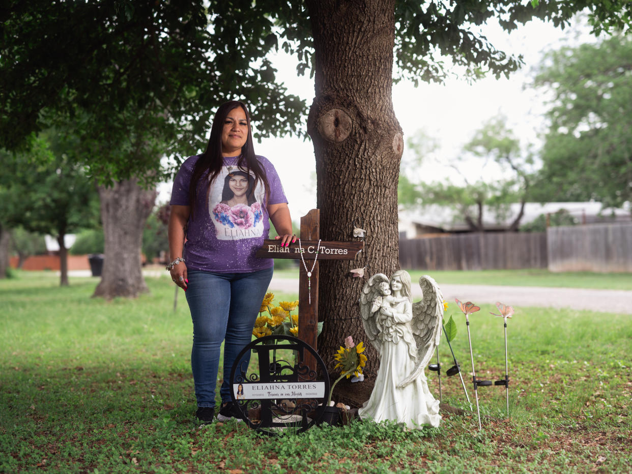Sandra Torres, who’s daughter Eliahna Torres was killed in the Massacre at Robb Elementary School, poses for a portrait next a memorial for her daughter on April 26, 2023 in Uvalde, Texas. (Jordan Vonderhaar for NBC News)