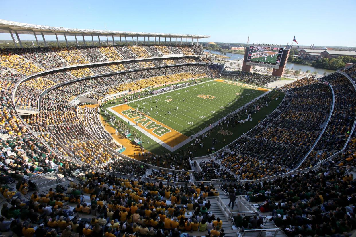 Fans watch a NCAA college football game against Kansas and Baylor inside McLane Stadium in the first half of an NCAA college football game, Saturday, Nov. 1, 2014, in Waco, Texas. (AP Photo/ Jerry Larson)