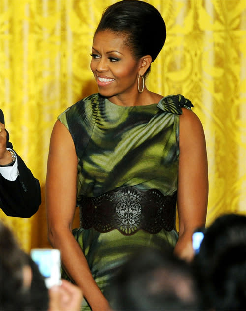 <b>Obama Cinco de Mayo party, June 2011</b><br><br>To celebrate Mexican Independence, Michelle opted for a green and black optic-print sleeveless dress by Laura Smalls and a large Alexander McQueen belt with cut-work detailing.