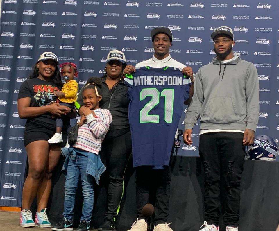 Cornerback Devon Witherspoon, the fifth pick in the NFL draft April 27, 2023, with his mother Rhasheda Bickley to his immediate right, plus his brother, sister and nieces at Seahawks headquarters in Renton April 28, 2023. Mom convinced her son to go out for football his junior year at Pine Forest High School in Pensacola, Florida. As Seattle coach Pete Carroll said, “Good for Mom! Nice call.” Gregg Bell/The News Tribune