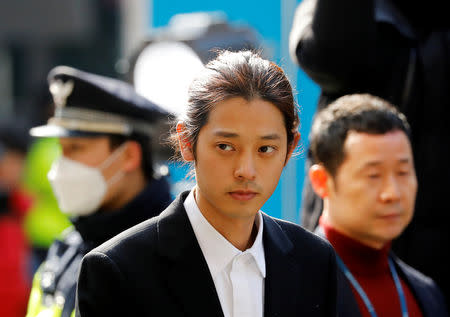 South Korean singer Jung Joon-young arrives for questioning on accusations of illicitly taping and sharing sex videos on social media, at the Seoul Metropolitan Police Agency in Seoul, South Korea, March 14, 2019. REUTERS/Kim Hong-Ji