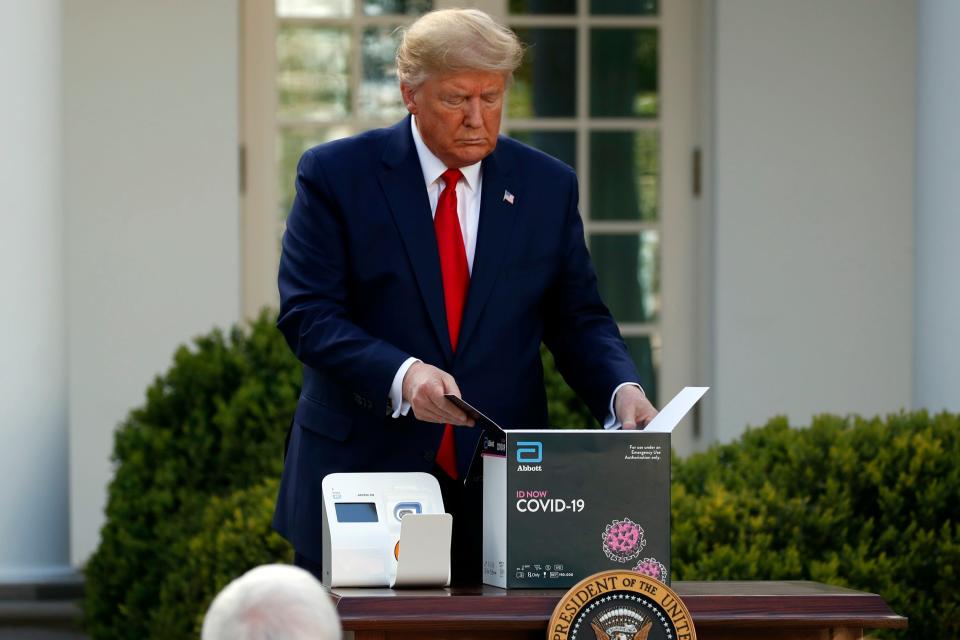 president donald trump white house lawn abbott coronovirus point of care poc rt pcr id now covid19 test box machine AP_20090769426250