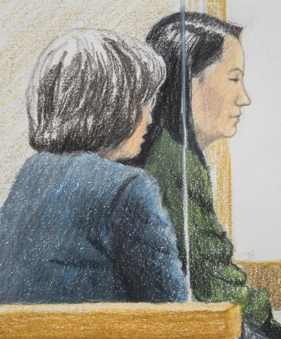 In this courtroom sketch, Meng Wanzhou, right, the chief financial officer of Huawei Technologies, sits beside a translator during a bail hearing at British Columbia Supreme Court in Vancouver, on Friday, Dec. 7, 2018. Meng faces extradition to the U.S. on charges of trying to evade U.S. sanctions on Iran. She appeared in a Vancouver court Friday to seek bail. (Jane Wolsak/The Canadian Press via AP)