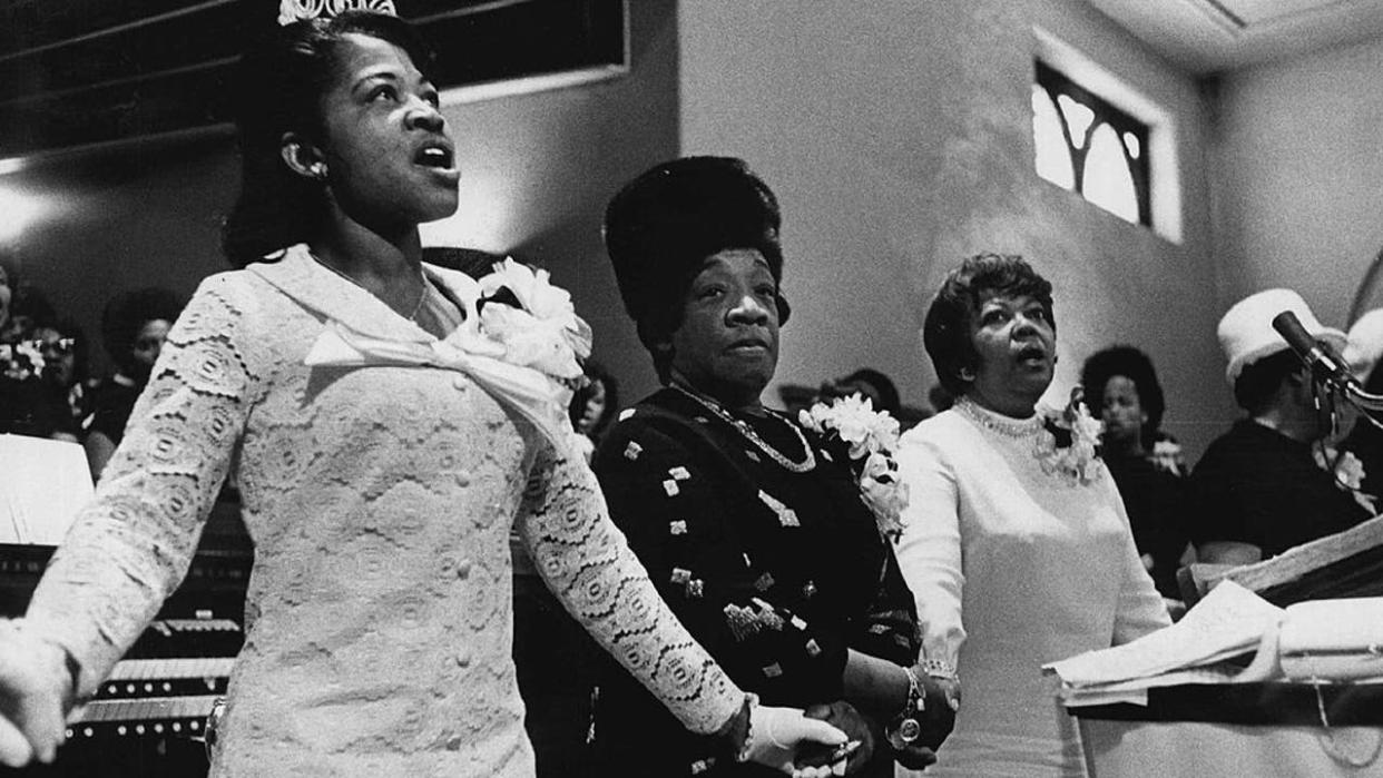 <div>MAR 12 1971, MAR 15 1971; Mrs. Martin Luther King Sr., Center, joins Hands with Co-chairman of Denver Event; Mrs. Ann Greene, left, and Mrs. Drusilla Mounger sang with her during Womans Day services in Baptist Church.; (Photo By Barry Staver/The Denver Post via Getty Images)</div>