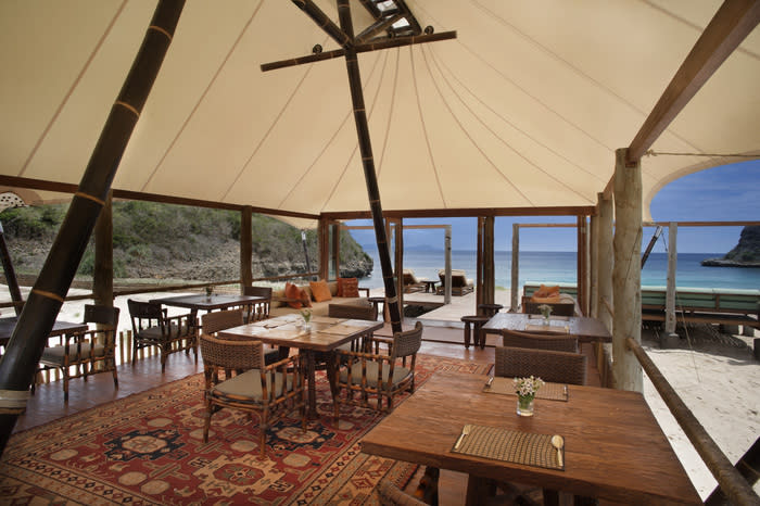 Luxury tent: Meals are served under the skies in a luxury tent complete with rugs and a library; everything is included here, due to the secluded location of Jeeva Beloam's resort. (