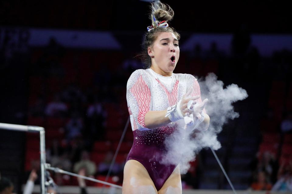 OU's Danielle Sievers celebrates after competing on the bars Thursday in an NCAA Regional at Lloyd Noble Center in Norman.