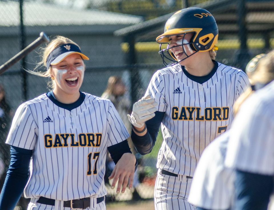 Jayden (left) and Aubrey (right) are each other's biggest fans on the diamond.