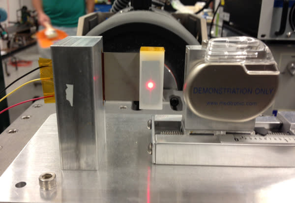 A piece of piezoelectric material (left) could someday replace the battery in a traditional pacemaker (right).