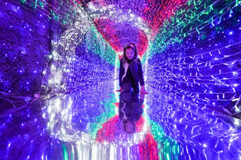 CHARLESTOWN, ENGLAND - DECEMBER 03: Eight year-old Bellami Smit visits the festive Tunnel of Lights at the Shipwreck Treasure Museum on December 3, 2020 in Charlestown, England. The tunnel is Europe"u2019s longest underground tunnel of festive lights. (Photo by Hugh Hastings/Getty Images)