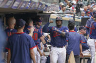 Minnesota Twins's Miguel Sano is greeted in dugout after hitting a home. run in the fourth inning of a baseball game against Detroit Tigers, Wednesday, July 28, 2021, in Minneapolis. (Glen Stubbe/Star Tribune via AP)