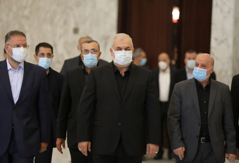 FILE PHOTO: Head of Hezbollah's parliamentary bloc Mohamed Raad, accompanied by his parliamentary bloc, walks at the presidential palace in Baabda