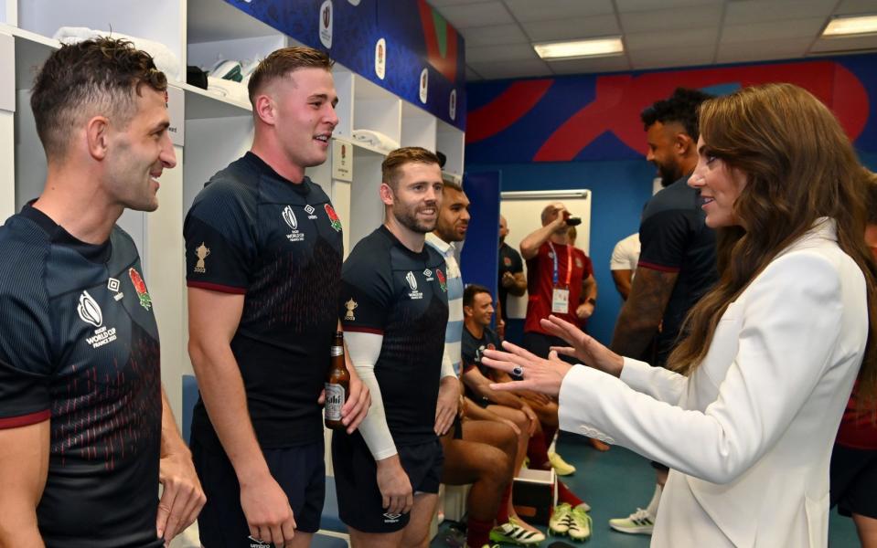 Catherine, Princess of Wales, chats with Freddie Steward and Jonny May after England's World Cup victory over Argentina