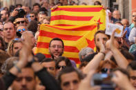 Protestors hold Esteladas (Catalan separatist flags) during a rally in favour of a planned referendum on the independence of Catalonia in Madrid, Spain, September 17, 2017. REUTERS/Sergio Perez