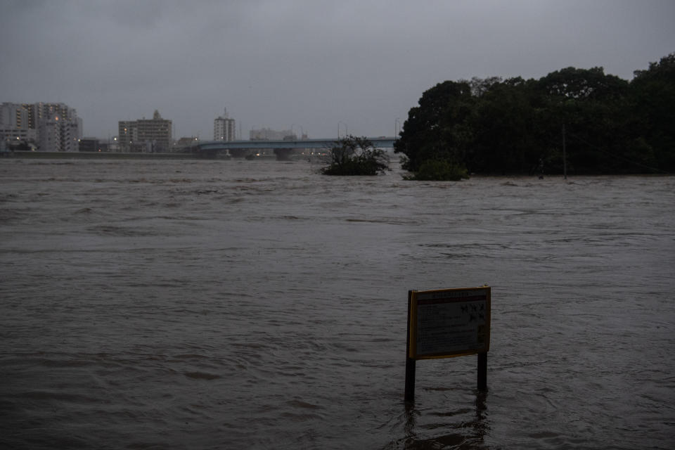 TOKYO, JAPAN - OCTOBER 12: A sign is partially submerged as the Tama River floods during Typhoon Hagibis on October 12, 2019 in Tokyo, Japan. Typhoon Hagibis is the most powerful typhoon to hit Japan this year and has been classed by the Japan Meteorological Agency as a 'violent typhoon' - the highest category on Japans typhoon scale. (Photo by Carl Court/Getty Images)