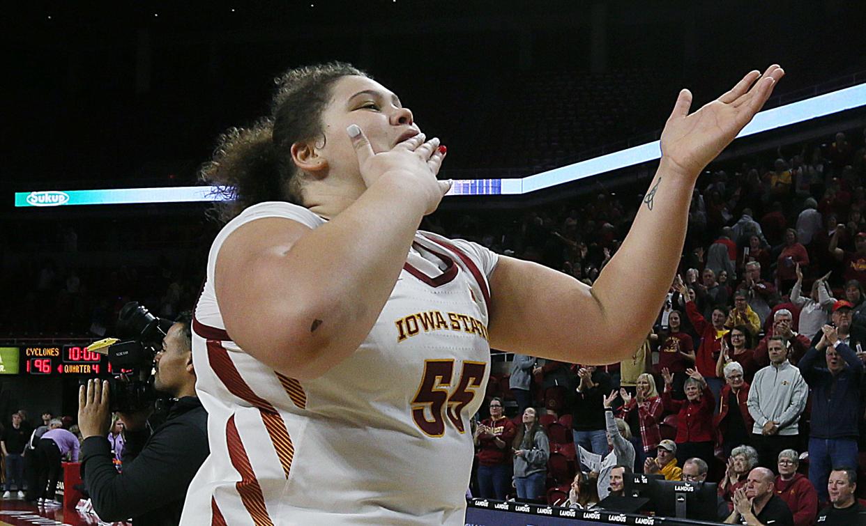 Iowa State Cyclones center Audi Crooks (55) kisses to the crowd while celebrating after winning 96-93 over Kansas State Wildcats in double over-time of a NCAA women's basketball at Hilton Coliseum on Feb.14, 2024, in Ames, Iowa.