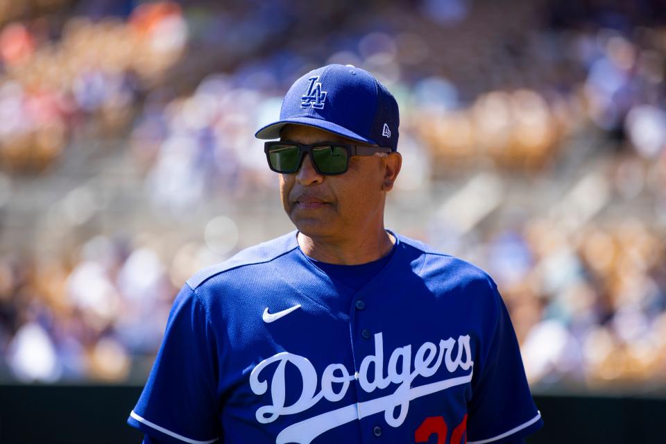 Los Angeles Dodgers manager Dave Roberts against the Cleveland Guardians during a spring training game at Camelback Ranch-Glendale.