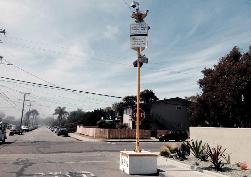 This Tuesday, April 8, 2014 photo shows a police surveillance tower in Isla Vista, Calif. With streets still littered in glass and garbage cans overflowing with red cups and bottles, University of California, Santa Barbara students were trying to shake off a lingering hangover days after their annual spring party morphed into a raucous and violent blowout. (AP Photo/Tami Abdollah)