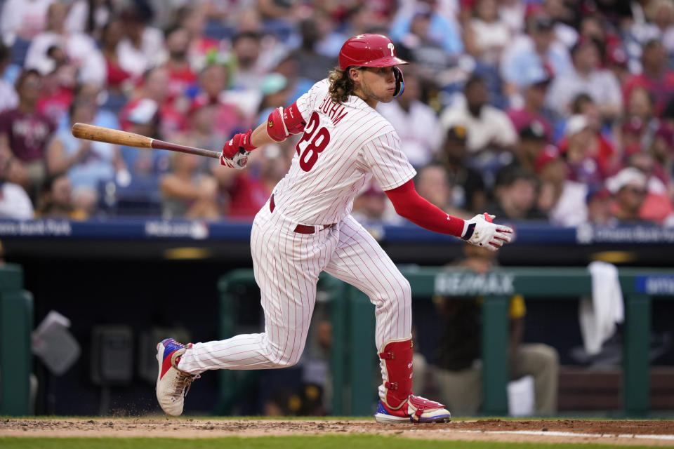 Philadelphia Phillies' Alec Bohm follows through after hitting a run-scoring double against San Diego Padres starting pitcher Yu Darvish during the fourth inning of a baseball game, Friday, July 14, 2023, in Philadelphia. (AP Photo/Matt Slocum)