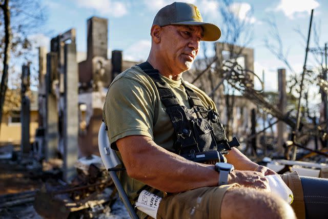 <p>Robert Gauthier/Los Angeles Times via Getty </p> Archie Kalepa was in Lake Tahoe when his neighborhood succumbed to flames. He arrived home a day after by boat, fighting overwhelming emotion as he floated toward the smoking rubble of Lahaina at Lahaina, Maui, Monday, August 14, 2023.