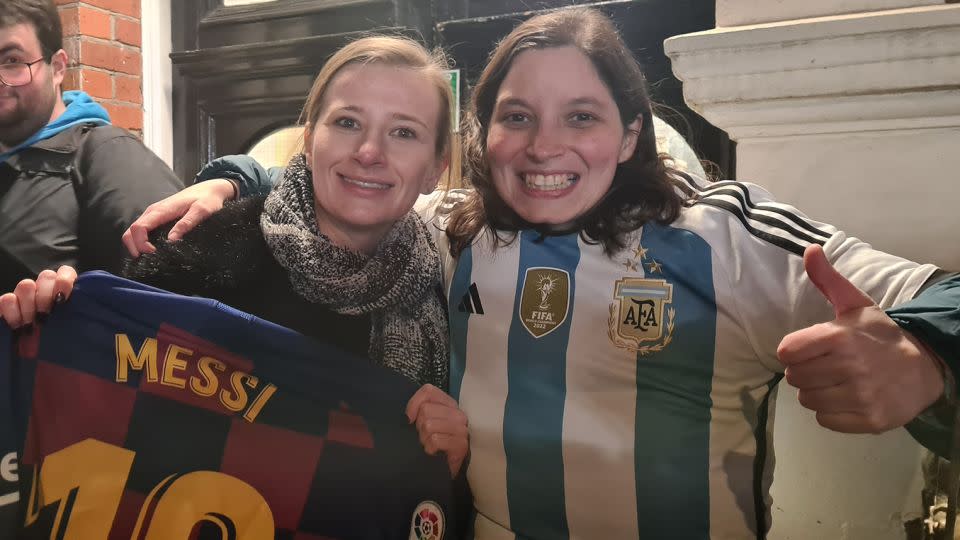 Johanne Perraud (L) and Romina Polenta (R) stood in a huddle of fans hoping to catch a glimpse of Lionel Messi, who ended up not attending the event. - Matias Grez/CNN