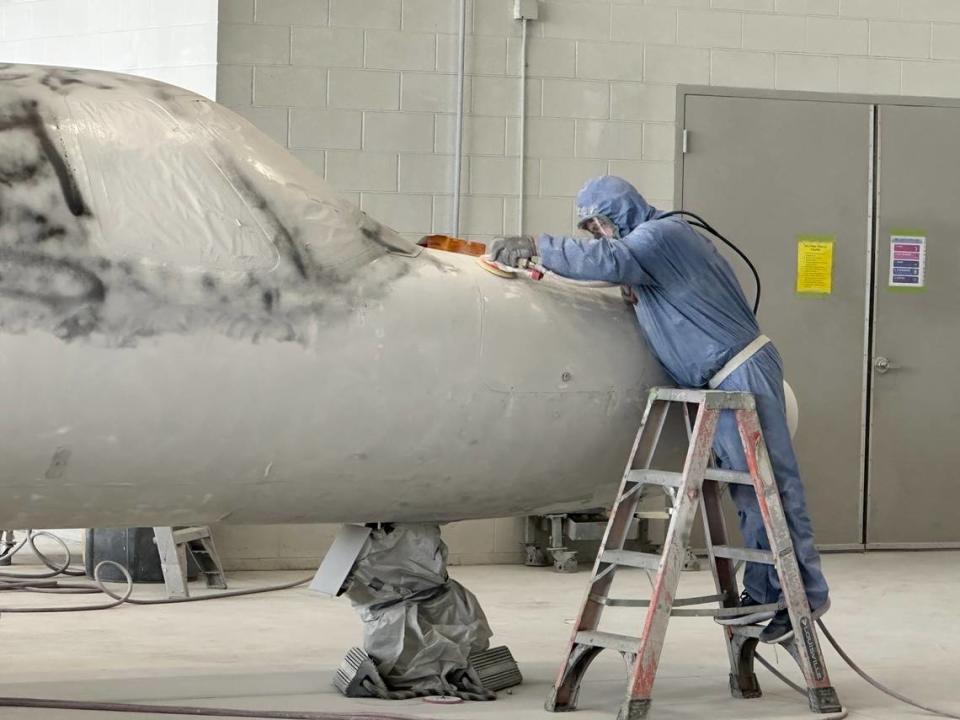 A worker removes paint from a small jet at flyExclusive in the N.C. Global TransPark in Kinston. The company has about 500 workers in the TransPark, making it the park’s largest employer. Richard Stradling/rstradling@newsobserver.com