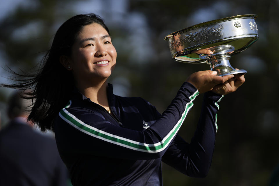 Rose Zhang poses with the trophy after winning the Augusta National Women's Amateur golf tournament, Saturday, April 1, 2023, in Augusta, Ga. (AP Photo/Matt Slocum)