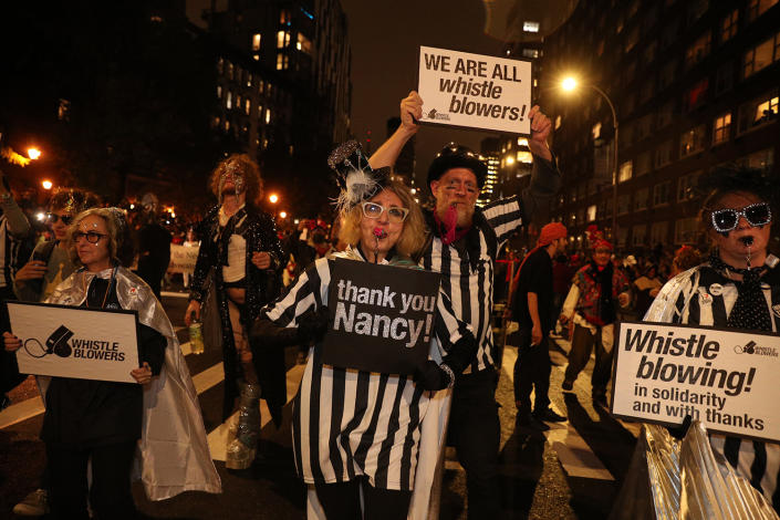 People wear whistleblower costumes in the 46th annual Village Halloween Parade in New York City. (Gordon Donovan/Yahoo News)