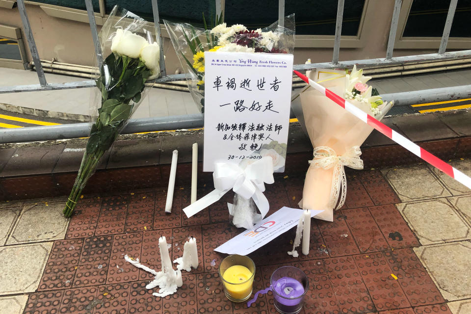 Flowers and cards seen at Lucky Plaza on Monday (30 December), a day after a fatal accident in which a car struck six Filipina domestic workers. (PHOTO: Dhany Osman / Yahoo News Singapore)