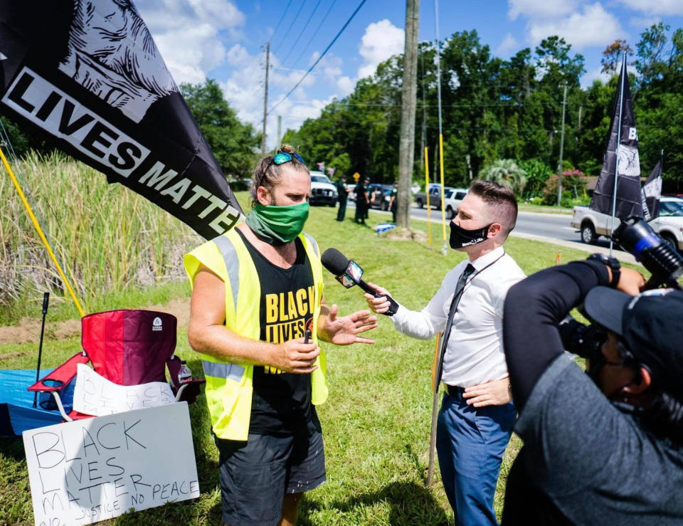 Kevin Conner, left, speaks at a demonstration in Middleburg, Fla. (Courtesy Matthew Bennett)