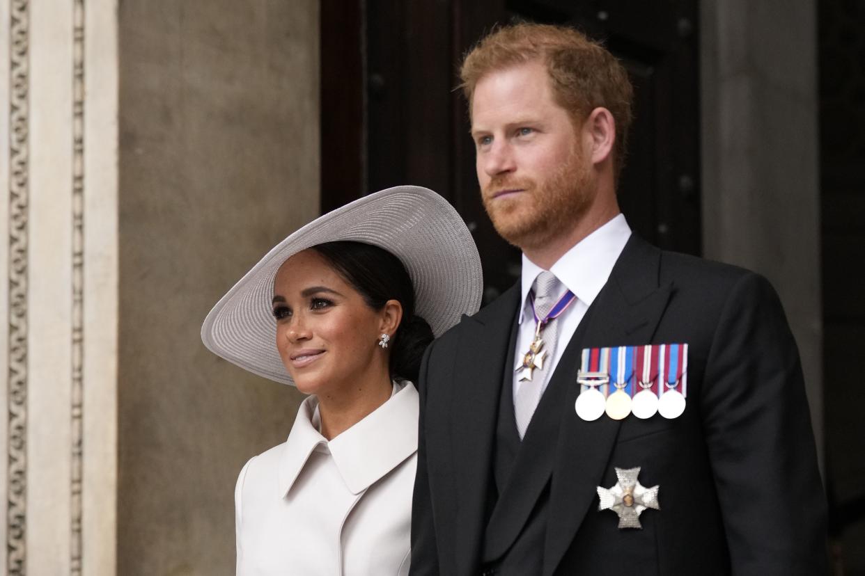 Prince Harry and Meghan Markle, Duke and Duchess of Sussex leave after a service of thanksgiving for the reign of Queen Elizabeth II at St Paul's Cathedral in London on Friday.
