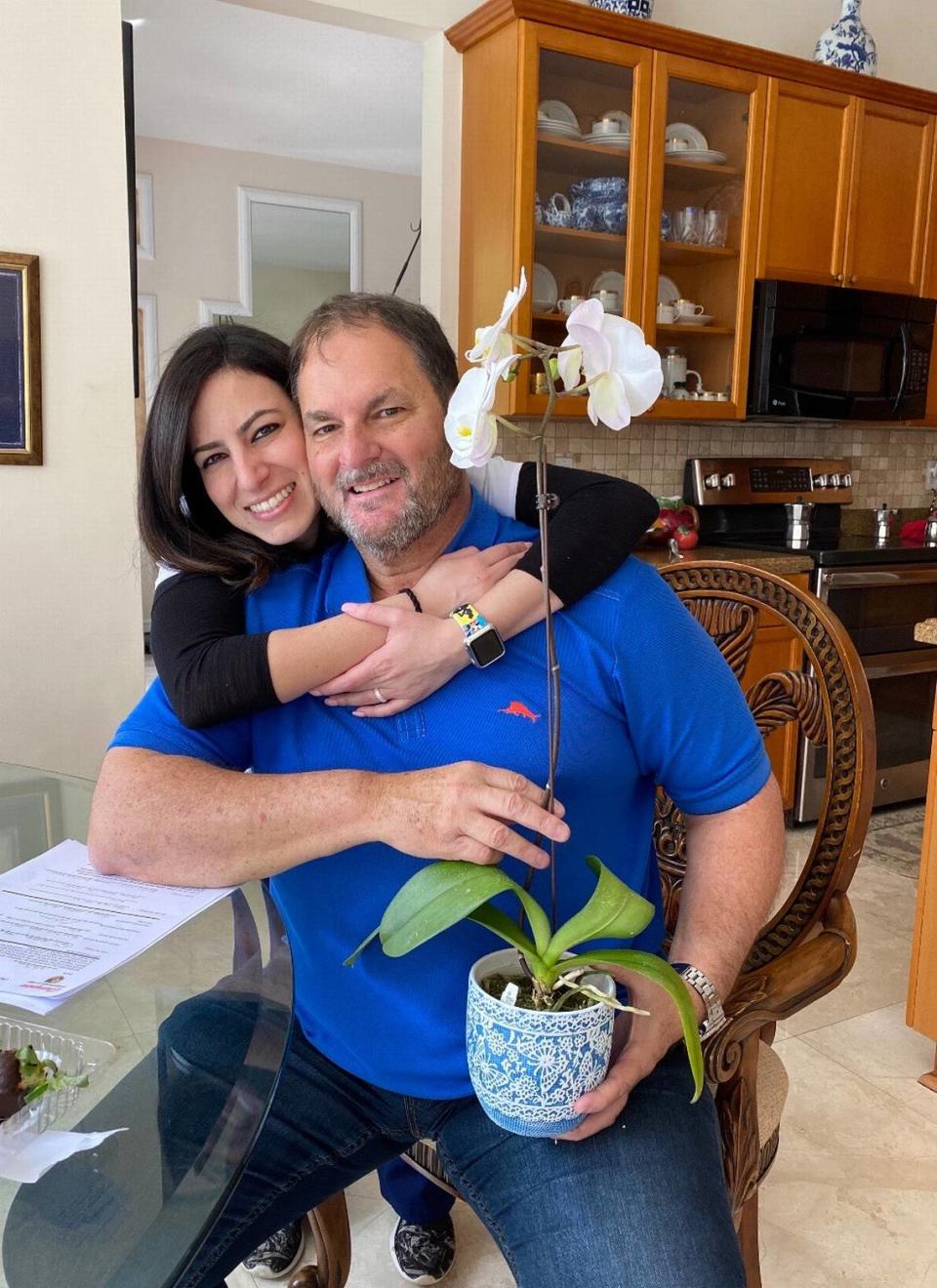 Dr. Carlos Vallejo, an internist in South Florida, poses with his daughter Gisselle Vallejo. Carlos Vallejo died from complications stemming from COVID-19 on Aug. 1, 2020.