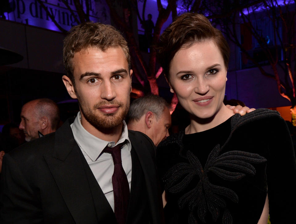 LOS ANGELES, CA - MARCH 18:  Actor Theo James (L) and writer Veronica Roth pose at the after party for the premiere of Summit Entertainment's 'Divergent' at The Armand Hammer Museum on March 18, 2014 in Los Angeles, California.  (Photo by Kevin Winter/Getty Images)