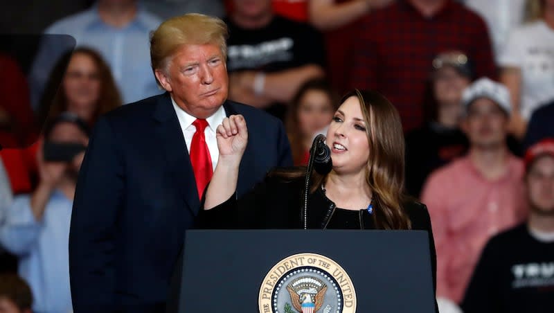 President Donald Trump listens as Chair of the Republican National Committee, Ronna McDaniel, right, speaks during a campaign rally Monday, Nov. 5, 2018, in Cape Girardeau, Mo. Former President Donald Trump mocked Republican National Committee Chairwoman Ronna McDaniel after she was fired from NBC.