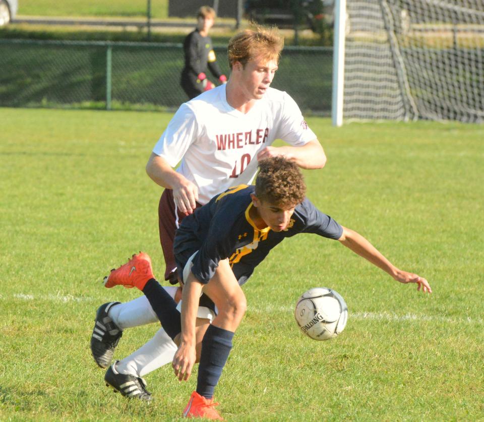 Norwich Tech's Landon Santana and Wheeler's Drew Deary battle for the ball during the Warriors' 1-0 win in Norwich.