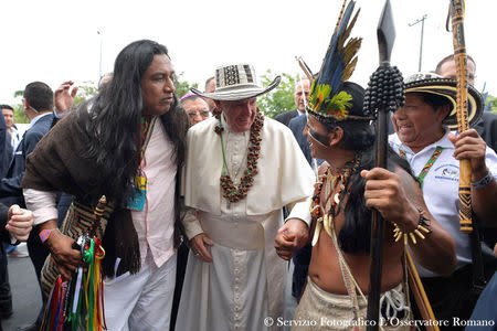 Pope Francis greets faithful dressed with a traditional costumes during the holy mass in Villavicencio, Colombia September 8, 2017. Osservatore Romano/Handout via REUTERS