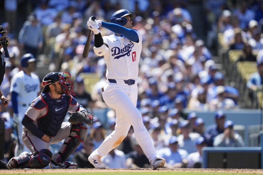 Los Angeles Dodgers designated hitter Shohei Ohtani (17) hits a home run during the eighth inning of a baseball game against the Atlanta Braves in Los Angeles, Sunday, May 5, 2024. (AP Photo/Ashley Landis)