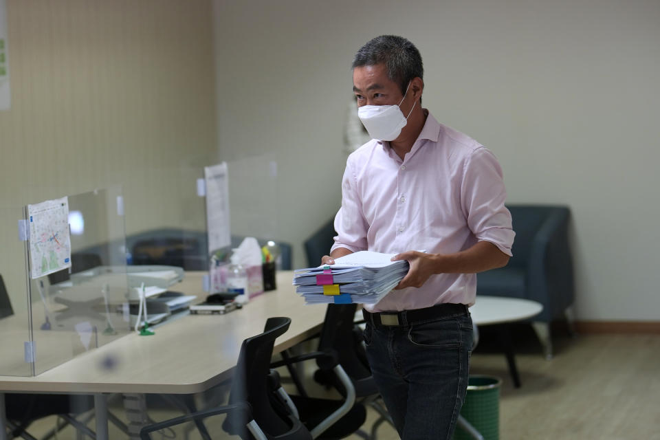 Peter Møller, attorney and co-head of the Danish Korean Rights Group, holds documents at the Truth and Reconciliation Commission in Seoul, South Korea, Tuesday, Aug. 23, 2022. Dozens of South Korean adoptees who were sent to Danish parents as children in the 1970s and ‘80s have formally demanded Tuesday, Aug 23, 2022, the South Korean government investigate the circumstances surrounding their adoptions, which they say were corrupted by systemic practices that falsified or obscured children's origins. (AP Photo/Lee Jin-man)