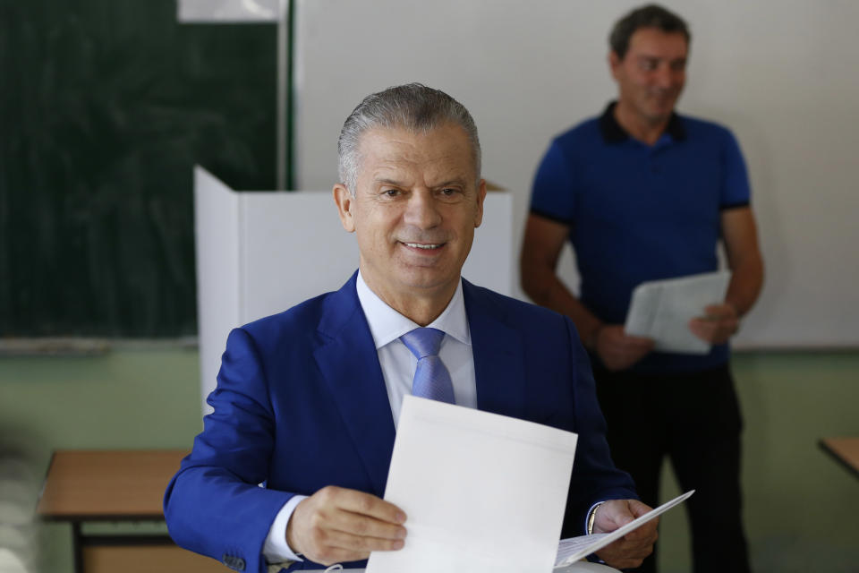 Fahrudin Radoncic, leader of SBB, Union for a Better Future of BiH, casts his vote at a polling station in Sarajevo, Bosnia, on Sunday, Oct. 7, 2018. Bosnians were voting Sunday in a general election that could install a pro-Russian nationalist to a top post and cement the ethnic divisions of a country that faced a brutal war 25 years ago. (AP Photo/Amel Emric)