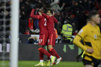 Liverpool's Divock Origi, left, celebrates after scoring the opening goal during the English Premier League soccer match between Wolverhampton Wanderers and Liverpool at the Molineux Stadium in Wolverhampton, England, Saturday, Dec. 4, 2021. (AP Photo/Rui Vieira)