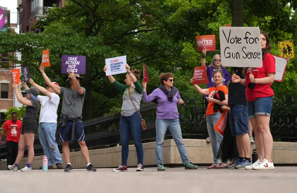 People rally Saturday, May 28, 2022, at the Ohio Statehouse during a vigil for the 19 students and two teachers killed at Robb Elementary School in Uvalde, Texas.