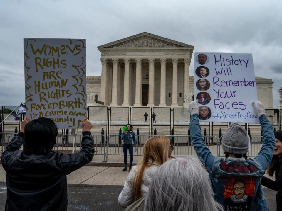 Protesters outside the US Supreme Court on Sunday (AP)