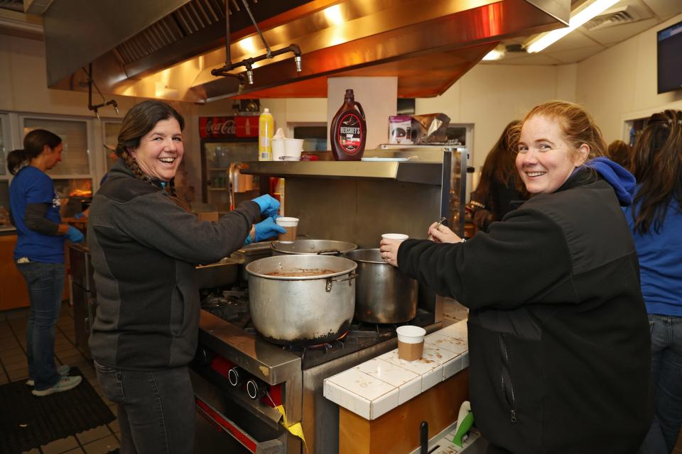 Steph Berdy and Cindy Schuster provided service with a smile from inside the Middletown High School concession stand.