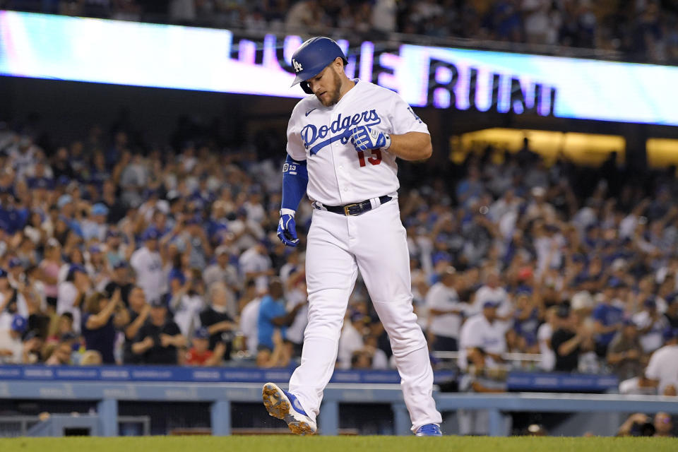 Los Angeles Dodgers' Max Muncy scores after hitting a solo home run during the third inning of a baseball game against the Minnesota Twins Tuesday, Aug. 9, 2022, in Los Angeles. (AP Photo/Mark J. Terrill)