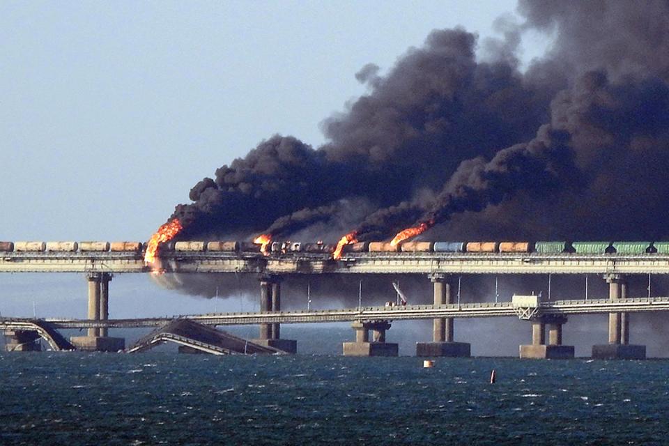 Black smoke billows from a fire on the Kerch bridge that links Crimea to Russia (AFP/Getty)
