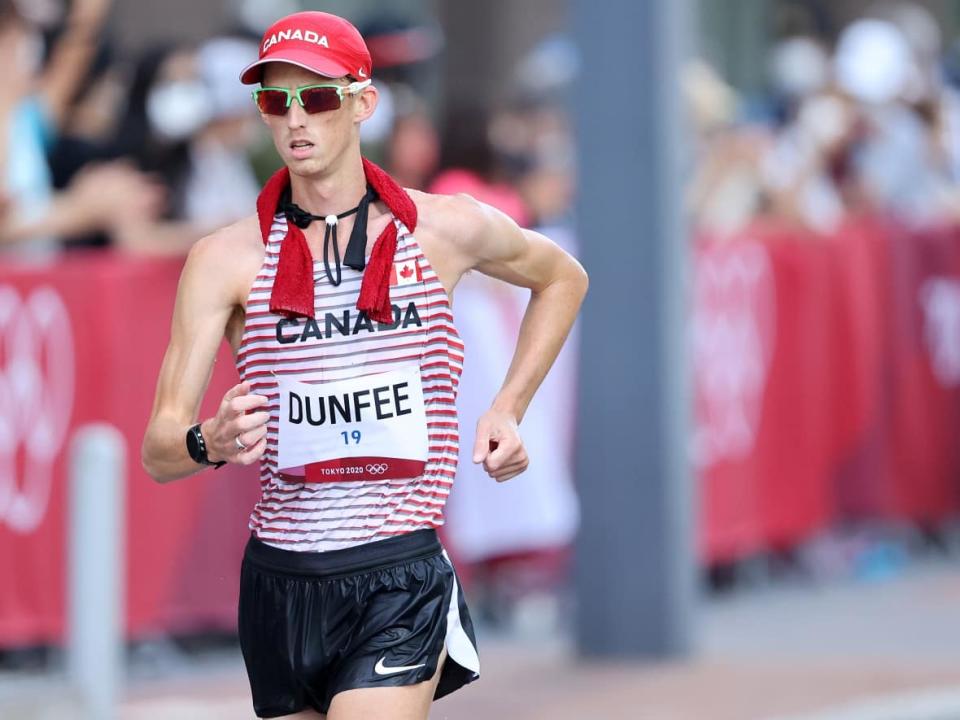 Evan Dunfee of Team Canada competes in the Men's 50km Race Walk Final on day fourteen of the Tokyo 2020 Olympic Games at Sapporo Odori Park on August 06, 2021 in Sapporo, Japan. (Clive Brunskill/Getty Images - image credit)