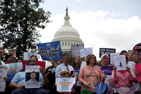 Activists participate in a rally to protect the Affordable Care Act outside the U.S. Capitol in Washington, U.S., September 19, 2017. REUTERS/Aaron P. Bernstein